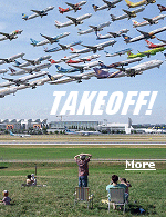 A sky littered with aircraft, each frozen in different moments of takeoff or landing, all in one photograph.